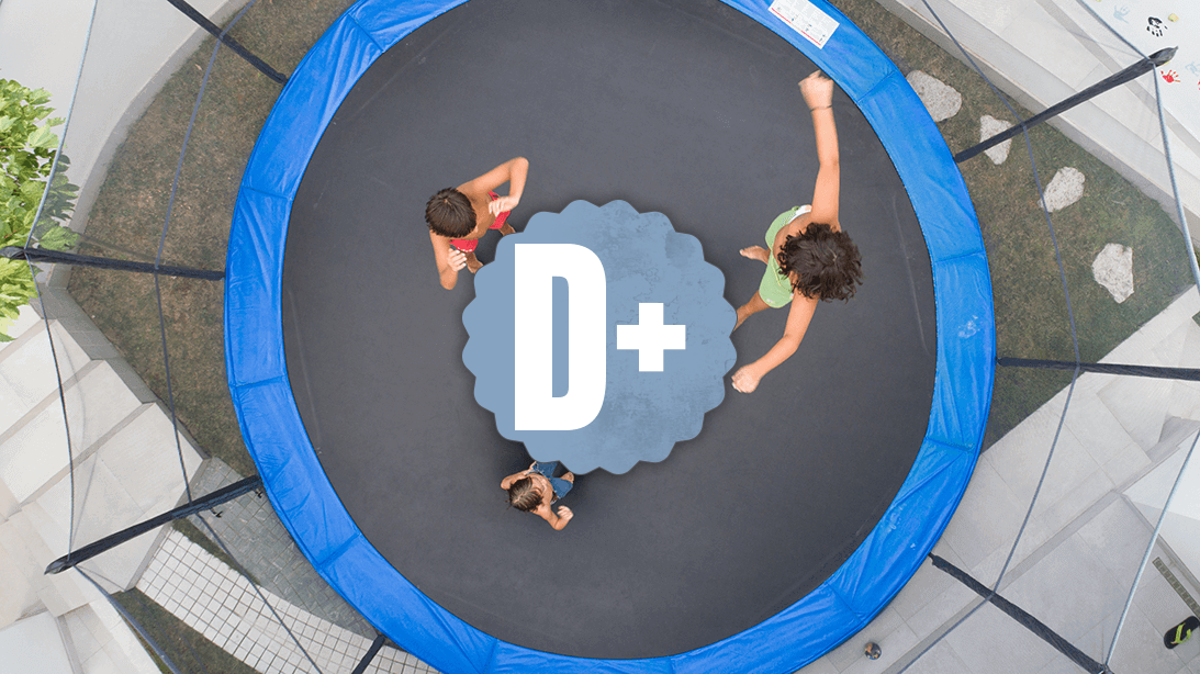 Ariel view of children playing on a trampoline below a D+ grade.