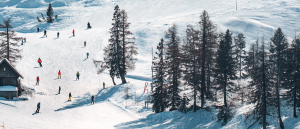 A group of people skiing on a hill.