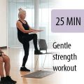 older instructor leading seated student in gym