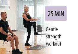 older instructor leading seated student in gym