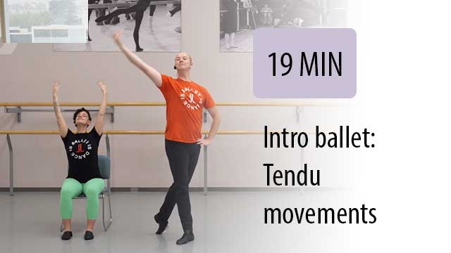 ballet instructor leading seated student in gym to tendu movements