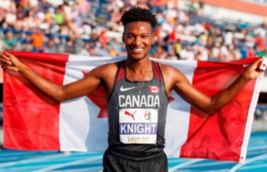 JUSTYN KNIGHT with Canadian flag