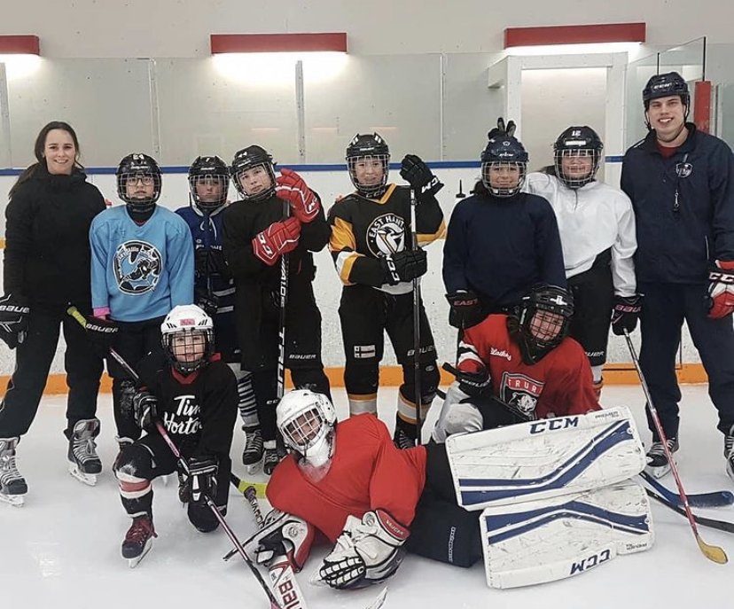 A group of hockey players posing for a photo.