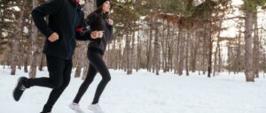 Couple jogging in the snow