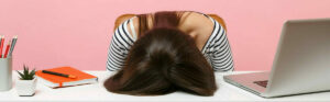 woman sleeping at her desk