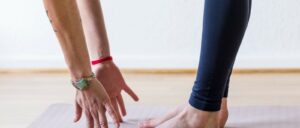 woman stretching to touch her toes