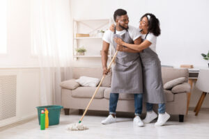 A couple doing housework, a great way to improve your heart health. 