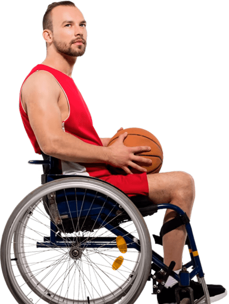 A man in a wheelchair holding a basketball 