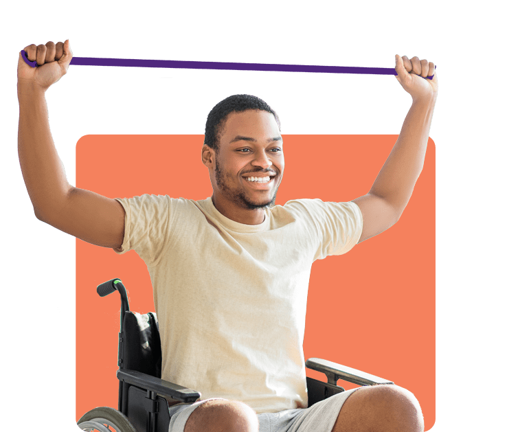 A smiling man using an exercise band over his head while seated in a wheelchair A smiling man using an exercise band over his head while seated in a wheelchair