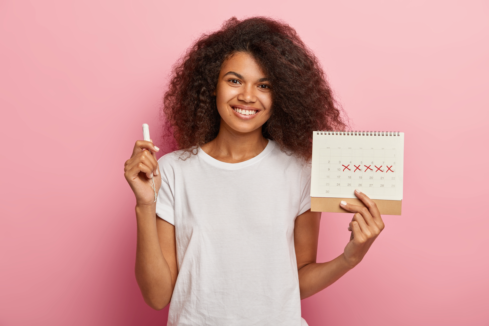period better girl smiling large A woman holding a calendar and a tampon