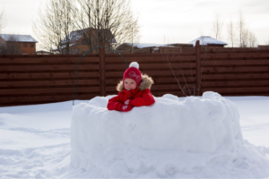 kid inside a snow fort