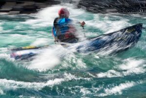 person paddling in the river