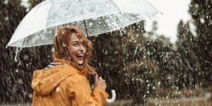 women under the rain with an umbrella