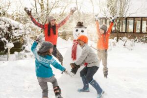 Family making snowperson