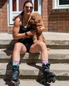 Natalie holding her dog