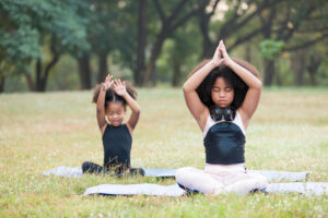 Two girls doing yoga