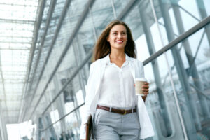 Beautiful,Woman,Going,To,Work,With,Coffee,Walking,Near,Office