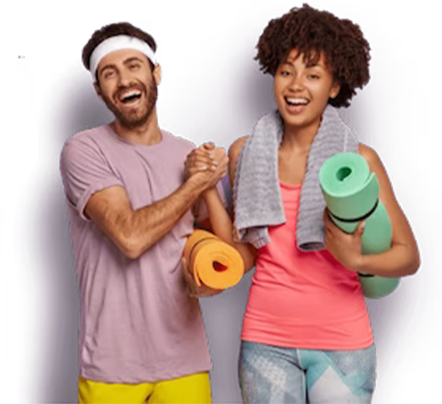 smiling couple with yoga mat under their arms