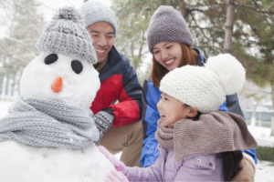 family making a snowperson