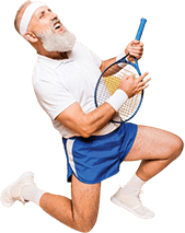 A senior man pretending to play guitar on a tennis racquet