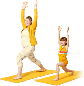 Mother and daughter doing yoga next to one another Mother and daughter doing yoga next to one another