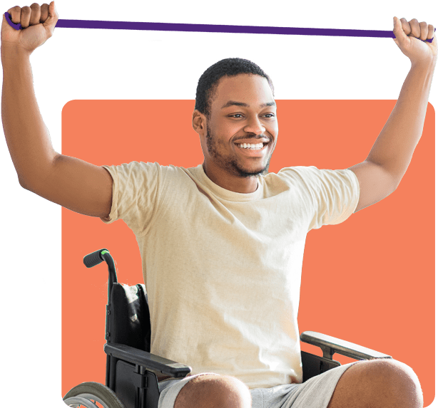 A smiling man using an exercise band over his head while seated in a wheelchair A smiling man using an exercise band over his head while seated in a wheelchair