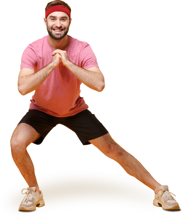 A smiling middle-aged man in athletic clothes doing a side lunge