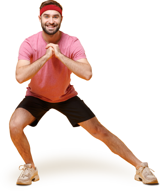 A smiling middle-aged man in athletic clothes doing a side lunge A smiling middle-aged man in athletic clothes doing a side lunge