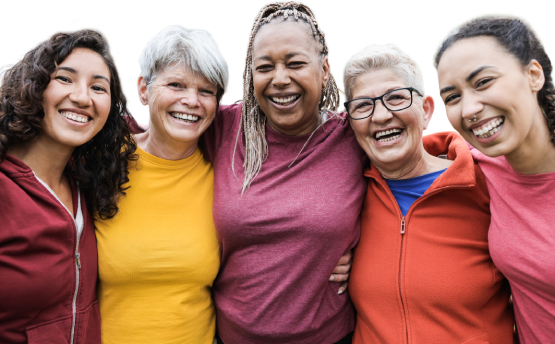 A group of active women smiling and embracing
