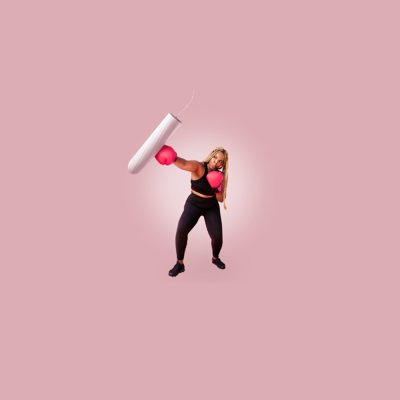 A woman in boxing gloves hitting tampon
