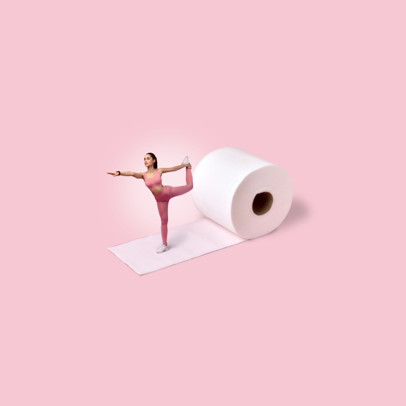 Image of woman in yoga pose on roll of toilet paper