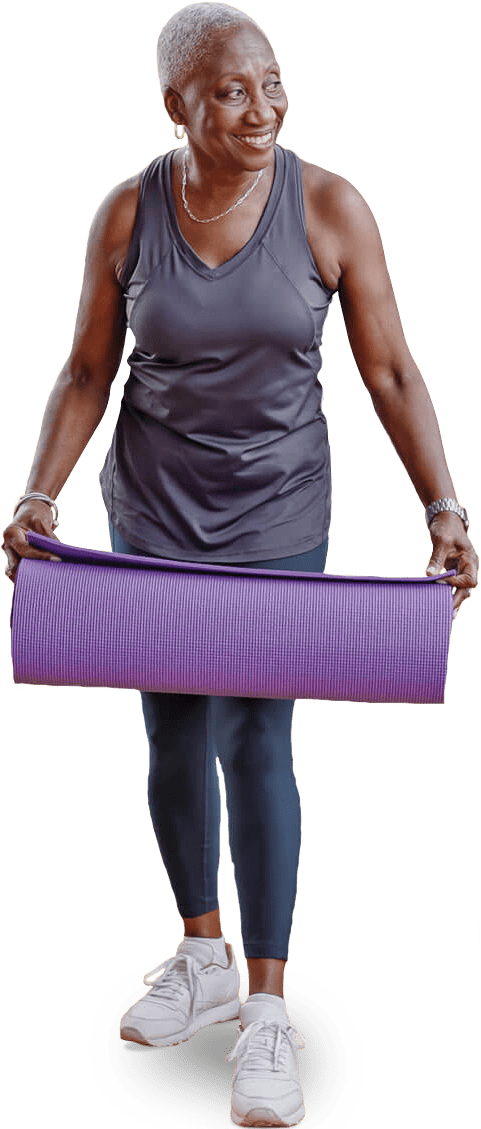 Senior lady holding a purple yoga mat