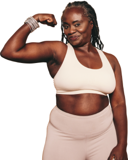 A middle-aged woman flexing her bicep A middle-aged woman flexing her bicep