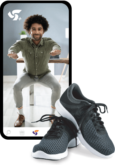 workplace-blackbdr A pair of black-and-white running shoes beside a smartphone displaying a photo of a man doing a squat