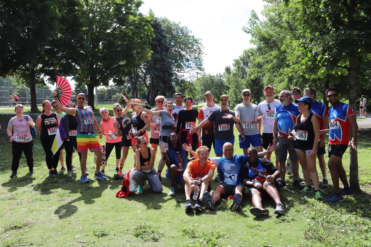 Members of the Ottawa Frontrunners posing for a group photo in a park