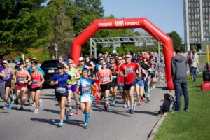 National Capital Pride Run participants running on a road