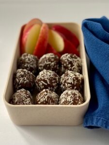 Nine Energy balls with slices of apple