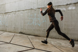A woman with a prosthetic leg running. 