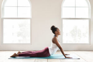 A woman doing the cobra exercise.A woman doing the cobra exercise.