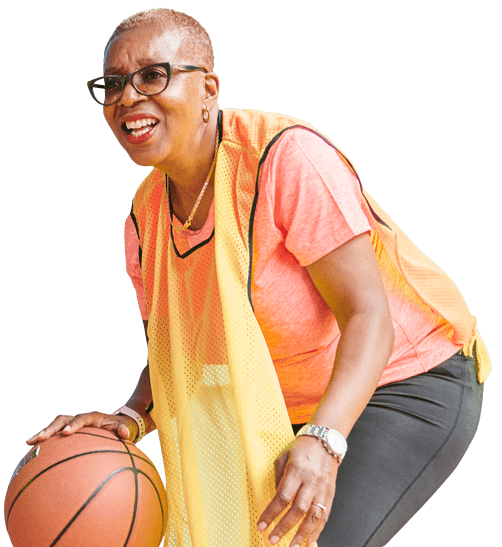 cc2023-basketballwoman-nobg-min woman smiling and dribbling basketball