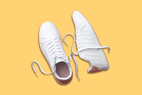a pair of white sneakers representing active transportation