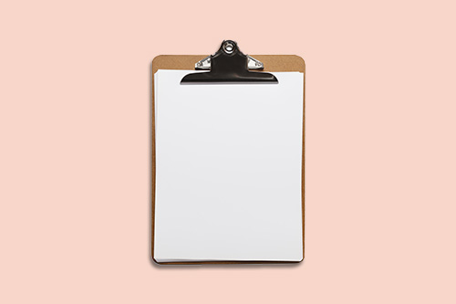 clipboard with a paper clipped on
