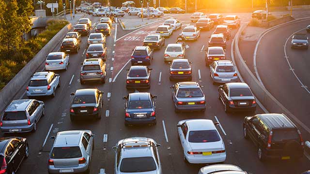 cars bumper to bumper on a six lane highway