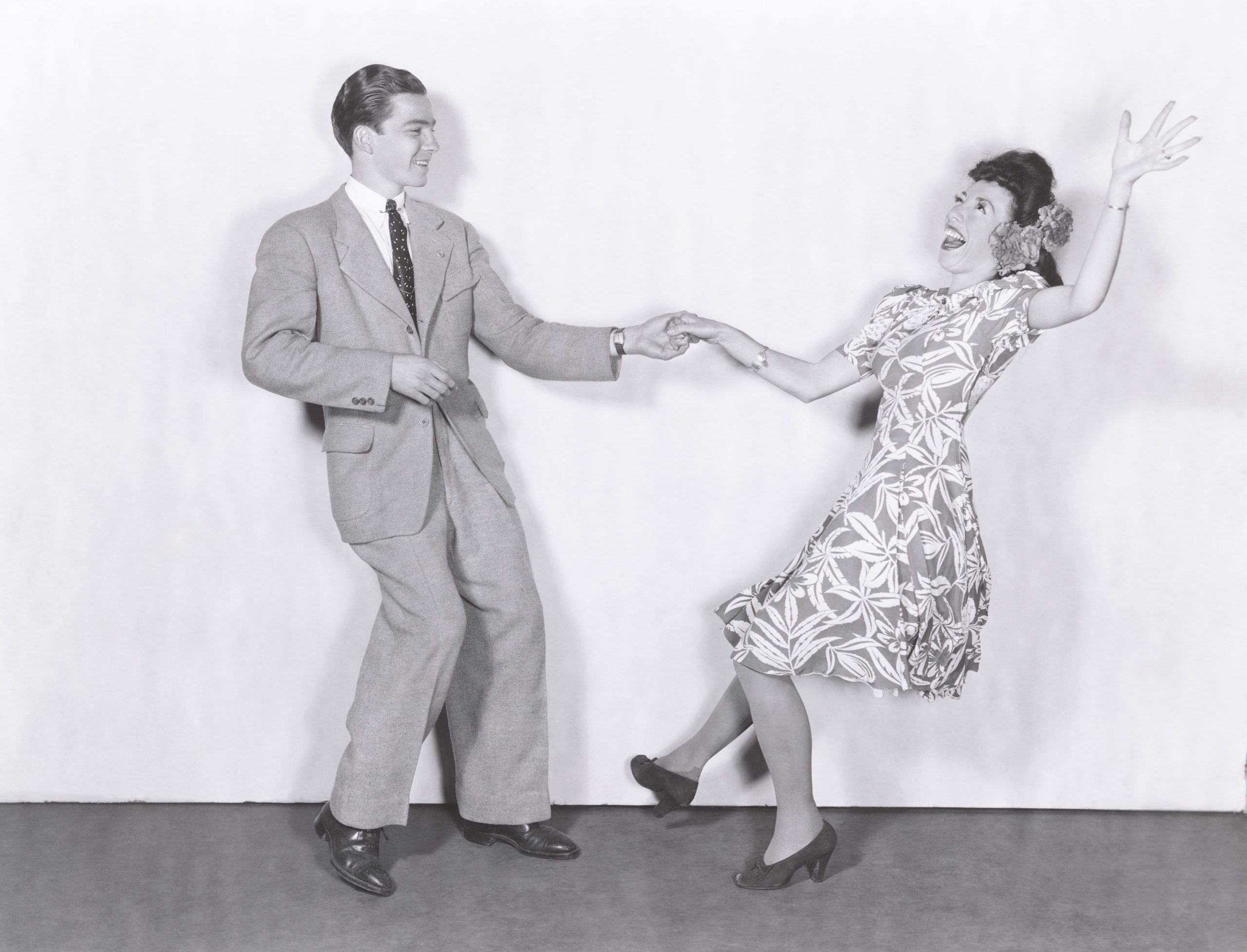 Two people swing dancing