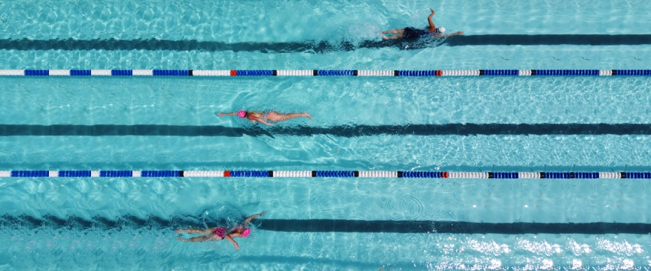 An aerial view of people swimming in a pool An aerial view of people swimming in a pool